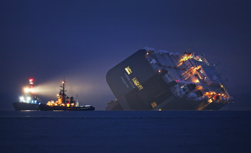 Illustration for article titled These Photos Of That Grounded Car Carrier Ship Are Beautifully Surreal